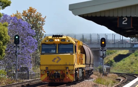 Freight train passing passenger platform
