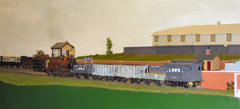 A Furness Railway 0-6-2 tank locomotive shunts the yard.