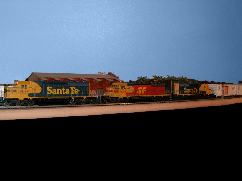 A trio of Santa Fe SD40-2 locomotives with one unit it the Kodachrome livery 