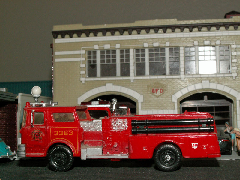 Pumper fire truck in front of the fire station