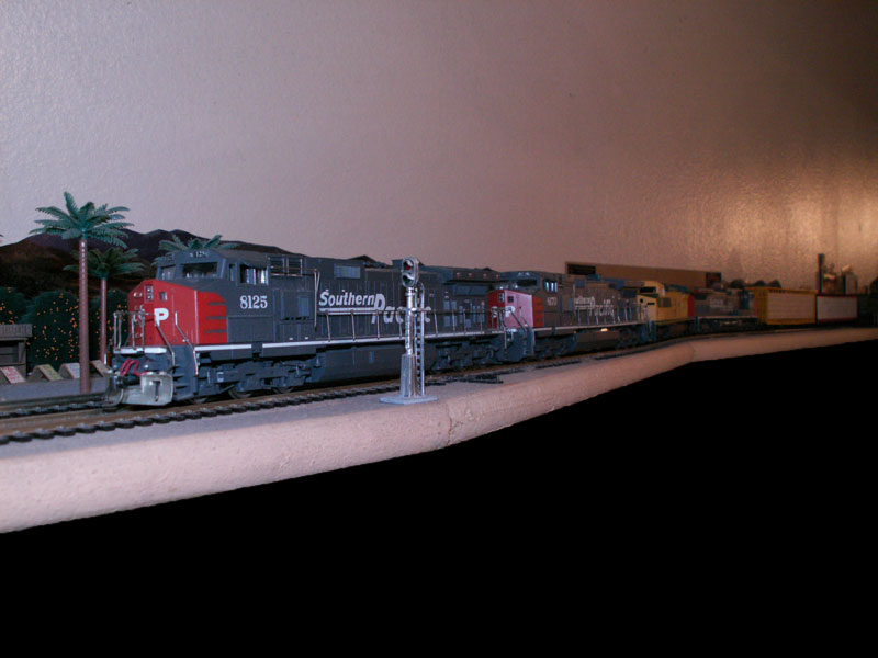 Southern Pacific freight train with lumber passes  through Redlands