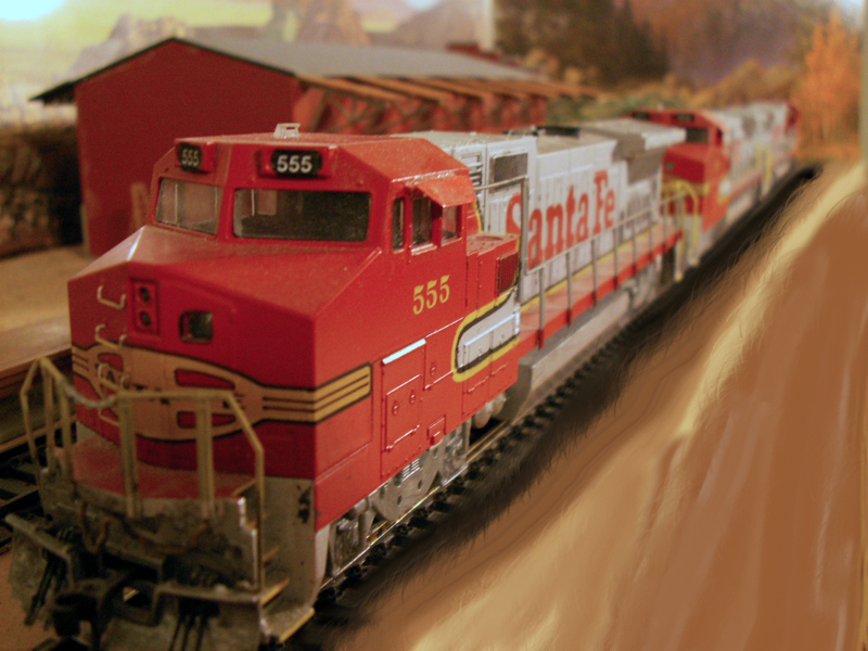 A trio of General Electric Locomotives flies through the foothills