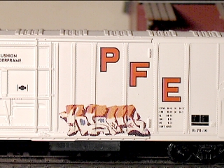 REM graffiti on a Pacific Fruit Express reefer