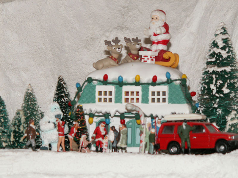 The Wolf Mountain Ski Lodge is decorated for Christmas with a decorative Santa 