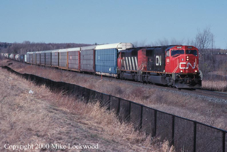 CN 5648 and 5547 on #204 at Richmond Hill Apr.10, 1999 @ 1700