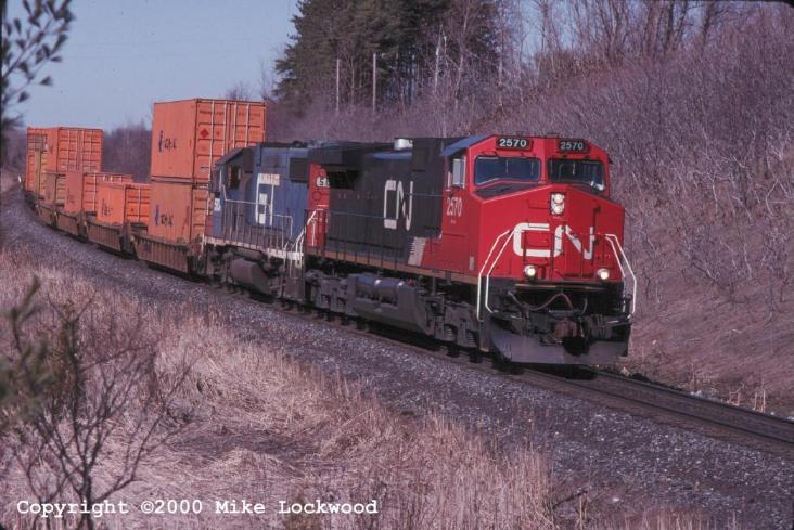 CN 2570 and GTW 5831 on #143 Mar 27/99 @ 14:19