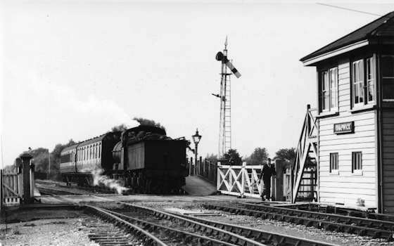 A Down train passing Shapwick signal-box