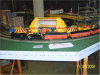 This customized Arcade and Attica excursion train is passing the American Flyer Circus big top.