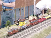 A close up picture of the accessories side of the layout. Notice the rocket launcher car. It has consistently been one of our best crowd pleasers.