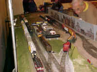 Chuck Smith is operating a switch locomotive in the yard modules.