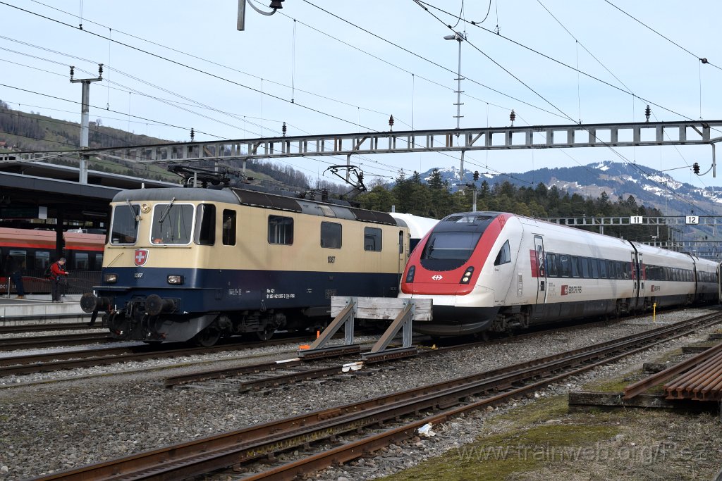 7885-0046-120322.jpg - IRSI Re 421.387-2 / Re 4/4'' 11387 (Re 91 85 4 421 387-2 CH-IRSI) + SBB-CFF ICN RABe 500.037 / Bt ICN 94 85 1 500.037-0 ''Grock'' (RABe 94 85 0 500 037-2 CH-SBB) / Arth-Goldau 12.3.2022