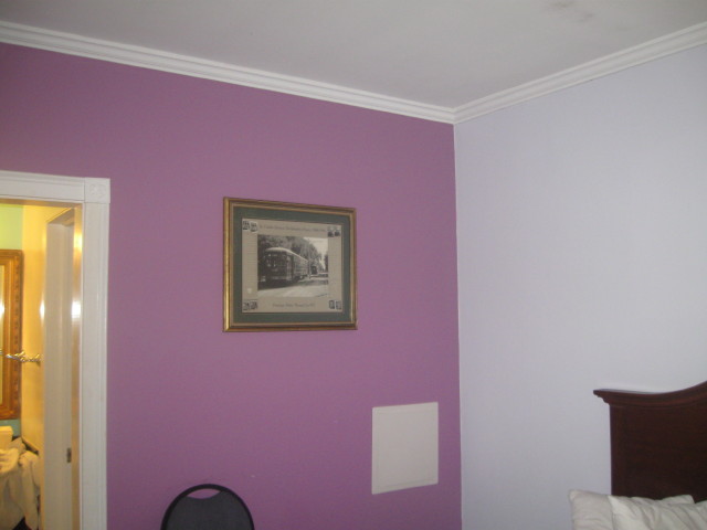 6724 motel room with
        Mardi Gras painted wall color 