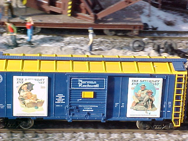 This photo is a a close up view of Norman Rockwell Art boxcars.