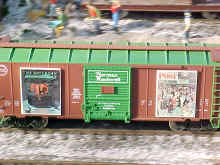This photo is a a close up view of Norman Rockwell Art boxcars.