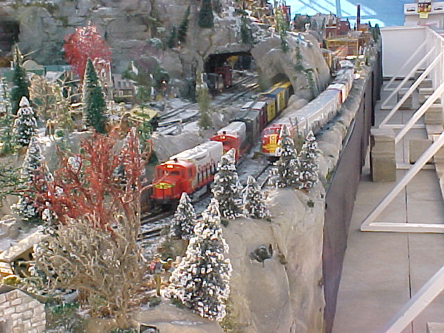 Two very nice Santa Fe locomotive sets head up these freight trains.