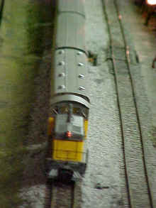 Close-up of switch locomotive pulling a Union Pacific passenger consist.
